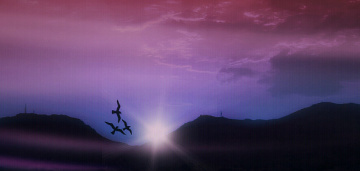 Dawn breaks beyond the mountains 
