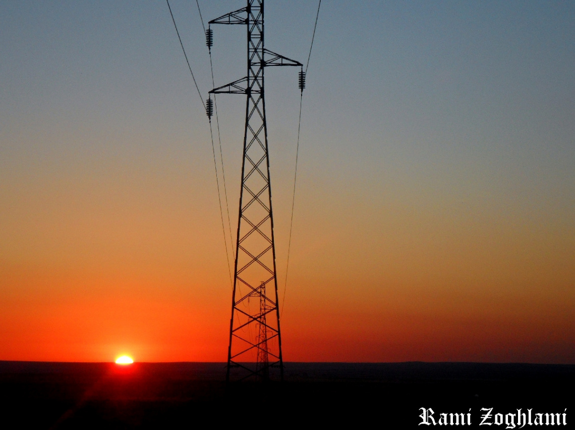 Sunrise and electric pole